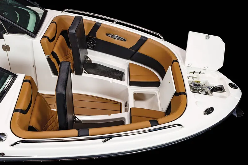 Slide: The Image of 2023 Chaparral 287 SSX boat interior with tan and black seating. - 13