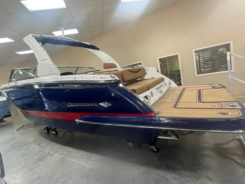Slide: The Image of 2023 Chaparral 287 SSX boat on display in showroom. - 2