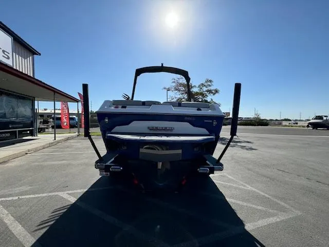 Slide: The Image of 2020 Axis A20 boat parked outdoors under clear sky. - 10