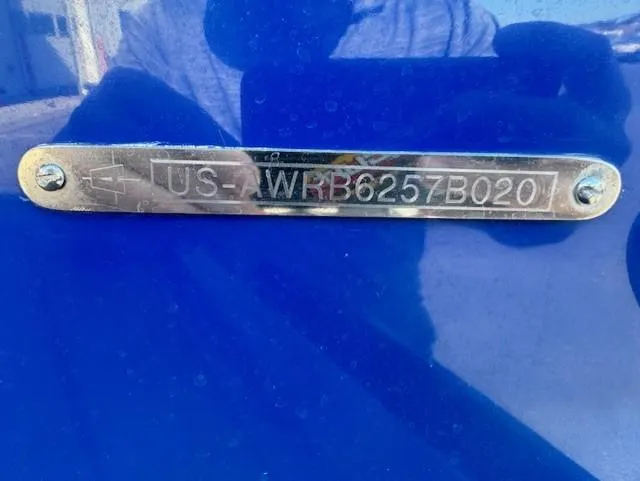 Slide: The Image of Metallic identification plate on a blue 2020 Axis A20 boat. - 16