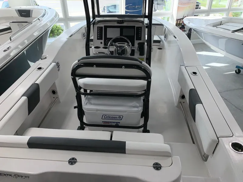 Slide: The Image of 2024 Robalo R202 Explorer boat interior with helm and seating. - 3