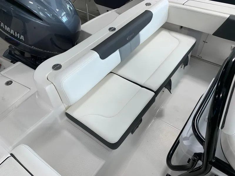 Slide: The Image of 2024 Robalo R202 Explorer boat with white cushioned seating and Yamaha engine. - 4