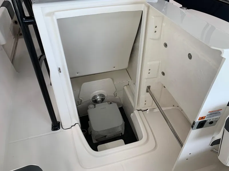 Slide: The Image of 2024 Robalo R202 Explorer boat interior storage compartment. - 8