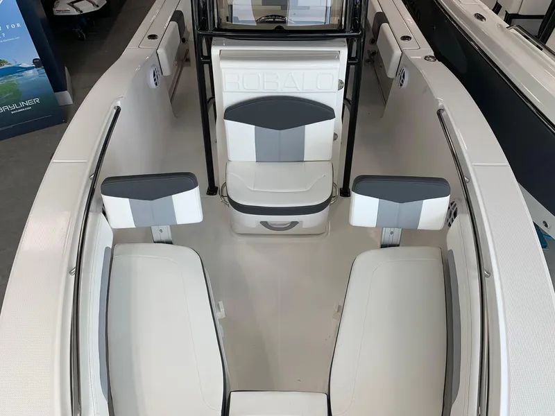 Slide: The Image of 2024 Robalo R202 Explorer boat interior with seating and console. - 10