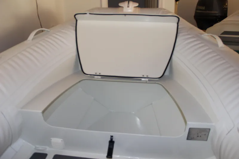 Slide: The Image of 2022 ZAR Mini RIB 14 HDL inflatable boat with open storage compartment. - 10