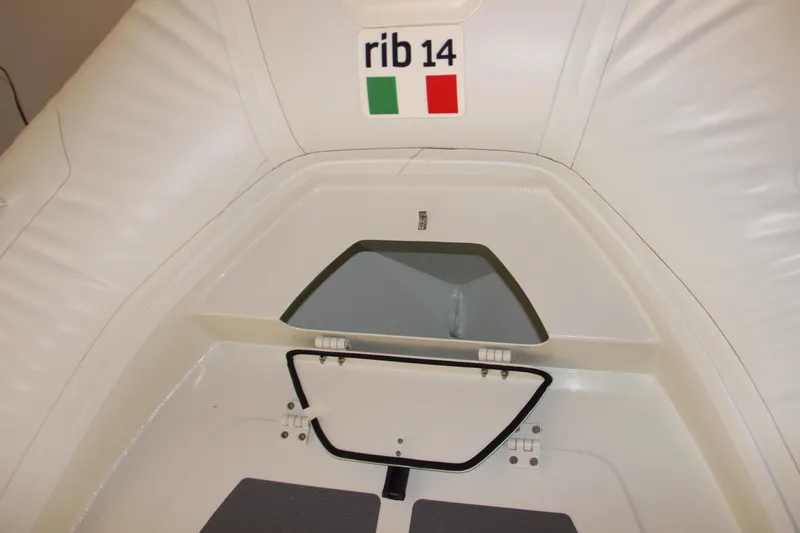 Slide: The Image of 2022 ZAR Mini RIB 14 HDL inflatable boat interior with storage compartment. - 11