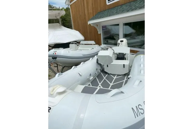 Slide: The Image of 2022 ZAR Mini RIB 14 HDL inflatable boats displayed outdoors. - 12
