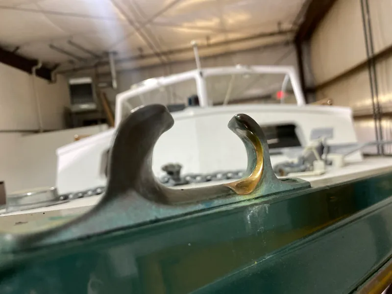 Slide: The Image of Close-up of a 1960 Classic Riverside Boat Co. cleat in a workshop. - 11