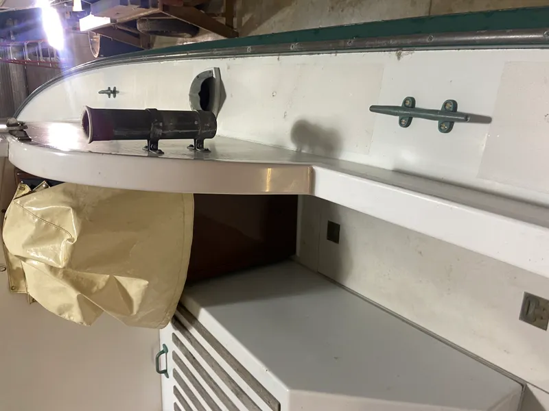 Slide: The Image of 1960 Classic Riverside Boat Co. interior with white deck and metal fittings. - 12
