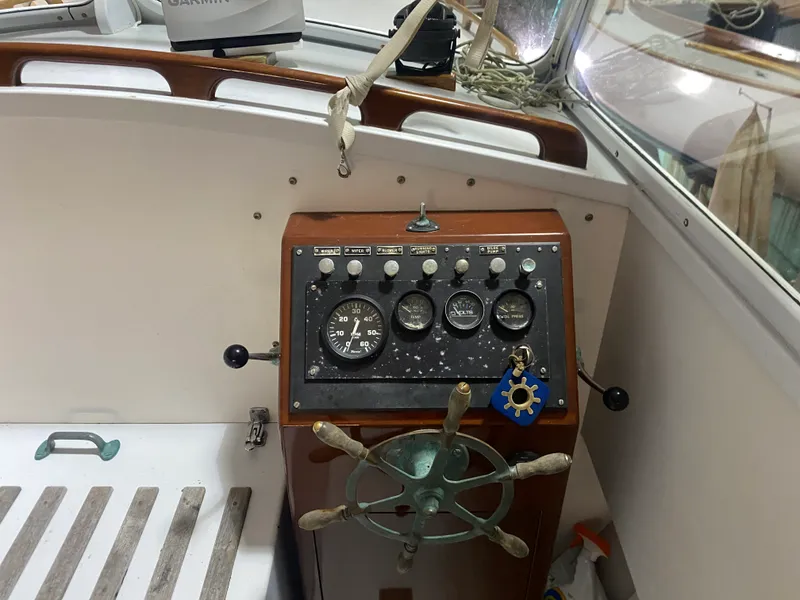 Slide: The Image of 1960 Classic Riverside Boat Co. dashboard with vintage steering wheel and gauges. - 15