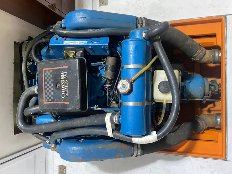 Slide: The Image of 1960 Classic Riverside Boat Co. engine, Chrysler Series 256, with blue components and hoses. - 19