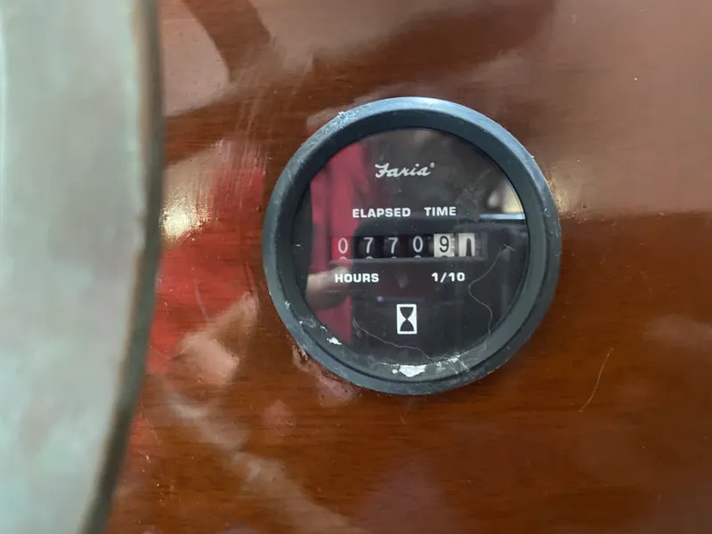 Slide: The Image of Elapsed time gauge on 1960 Classic Riverside Boat Co. dashboard, showing 7709.1 hours. - 20