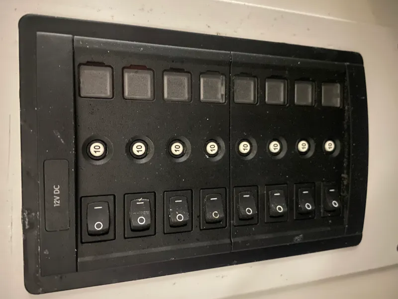 Slide: The Image of Control panel with switches and fuses, 12V DC, Classic Riverside Boat Co., 1960 model. - 21