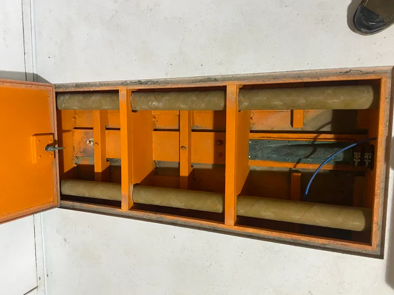 Slide: The Image of Orange mechanical compartment with rollers, part of a 1960 Classic Riverside Boat Co. model. - 22