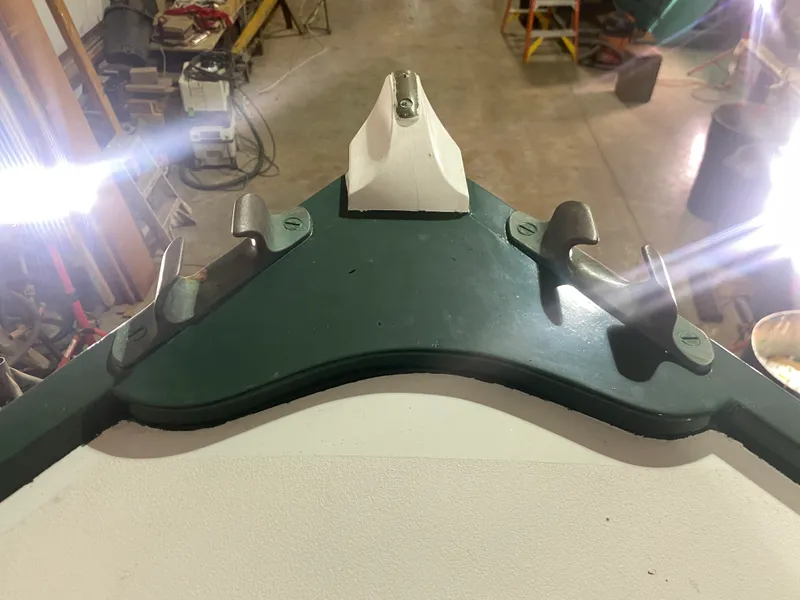 Slide: The Image of 1960 Classic Riverside Boat Co. bow detail in workshop with bright lighting. - 31