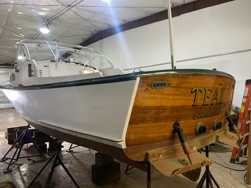 Slide: The Image of 1960 Classic Riverside Boat Co. vessel in a workshop, named "TEAL SAKONNET." - 4
