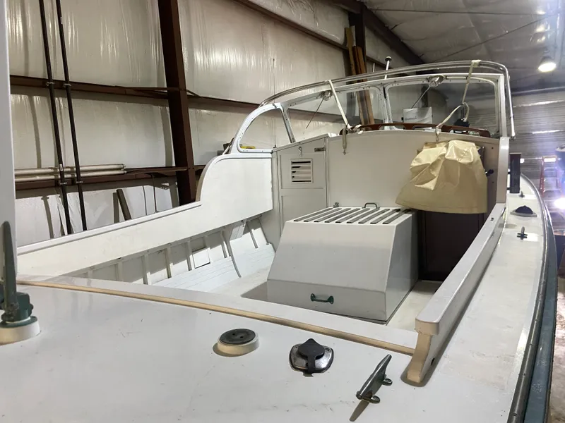 Slide: The Image of 1960 Classic Riverside Boat Co. vessel in storage, showcasing vintage design and craftsmanship. - 7