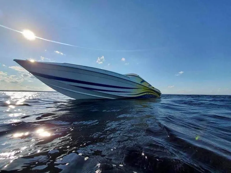 Slide: The Image of 2024 Velocity 322SC speedboat on open water under a bright sun. - 4