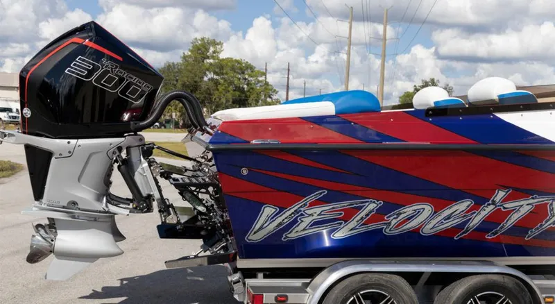 Slide: The Image of 2024 Velocity 260VR speedboat with powerful outboard motor on trailer. - 15