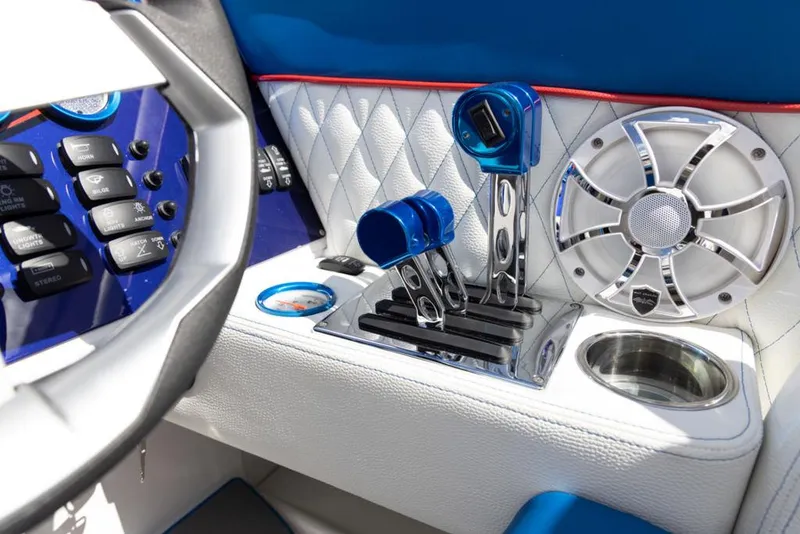 Slide: The Image of 2024 Velocity 260VR boat interior with control levers and speaker. - 5