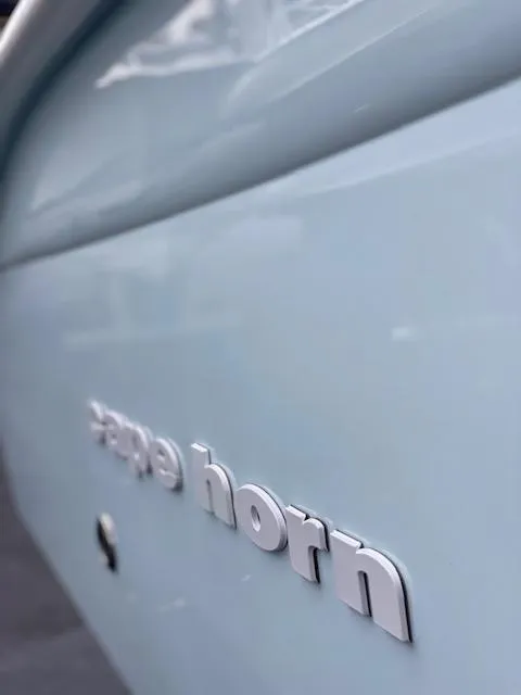 Slide: The Image of 2020 Cape Horn 24 XS boat close-up, showcasing sleek design and logo. - 12