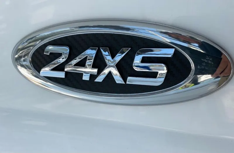 Slide: The Image of Chrome emblem of 2020 Cape Horn 24 XS boat model on white surface. - 22