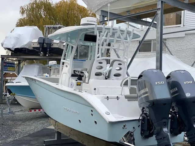 Slide: The Image of 2020 Cape Horn 24 XS boat with dual Yamaha 150 engines in storage. - 3