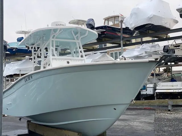 Slide: The Image of 2020 Cape Horn 24 XS boat in storage, featuring a sleek design and Garmin equipment. - 10