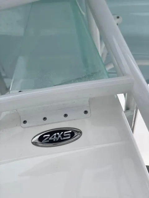 Slide: The Image of 2020 Cape Horn 24 XS boat detail with model emblem, white and teal design. - 11