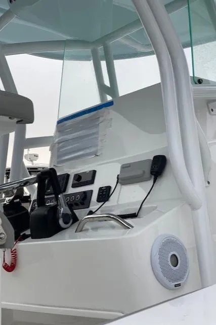 Slide: The Image of 2020 Cape Horn 24 XS boat dashboard with controls and communication devices. - 15