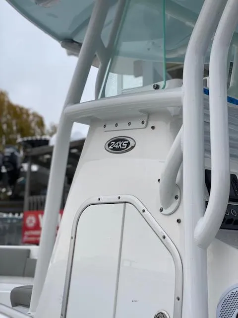 Slide: The Image of 2020 Cape Horn 24 XS boat, white exterior, close-up view of console and railing. - 6