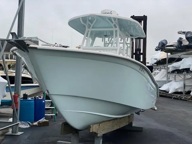 Slide: The Image of 2020 Cape Horn 24 XS boat on display at a marina. - 9
