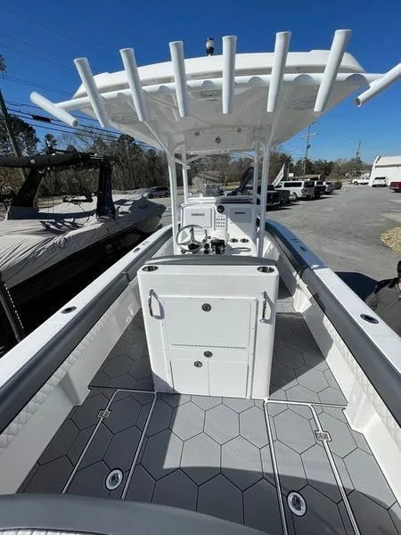 Slide: The Image of 2026 Velocity 262 CC boat interior with modern console and hexagonal flooring design. - 11