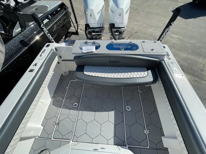Slide: The Image of 2026 Velocity 262 CC boat interior with hexagonal flooring and dual Mercury engines. - 20