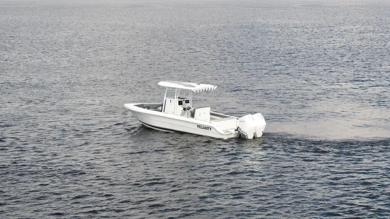 Slide: The Image of 2026 Velocity 262 CC boat cruising on open water. - 21
