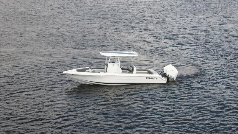 Slide: The Image of 2026 Velocity 262 CC boat cruising on open water. - 24