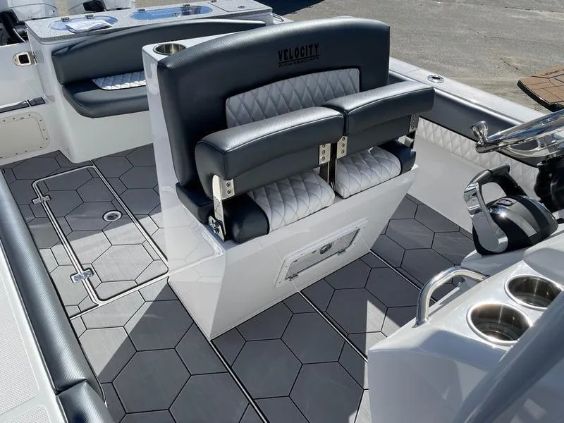 Slide: The Image of 2026 Velocity 262 CC boat interior with sleek seating and modern design. - 8