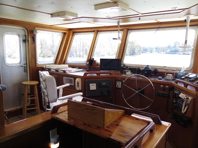 Slide: The Image of Rodriquez Custom 1998 boat interior with navigation equipment and panoramic windows. - 11