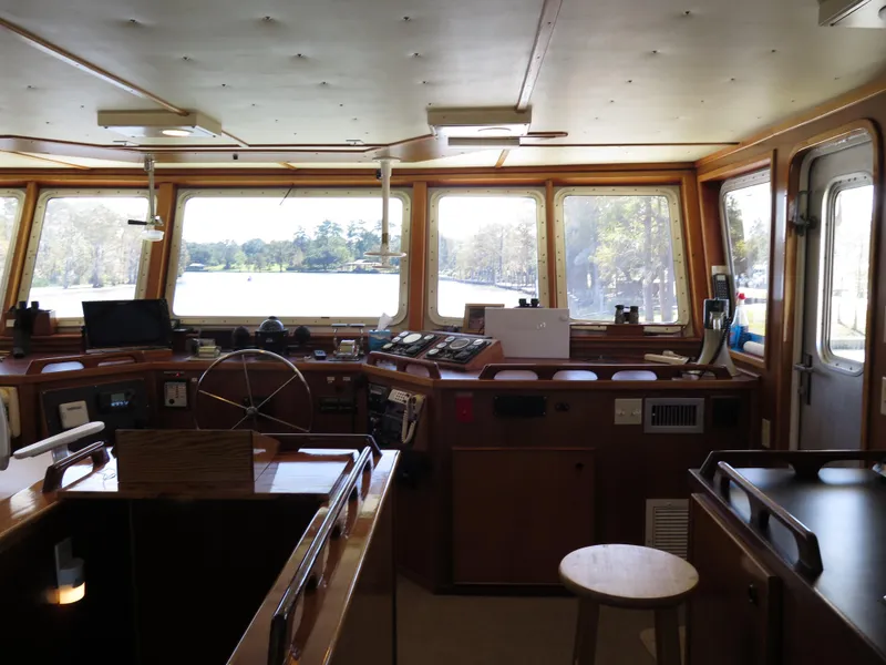 Slide: The Image of Interior of 1998 Rodriquez Custom boat cockpit with navigation equipment and panoramic windows. - 18