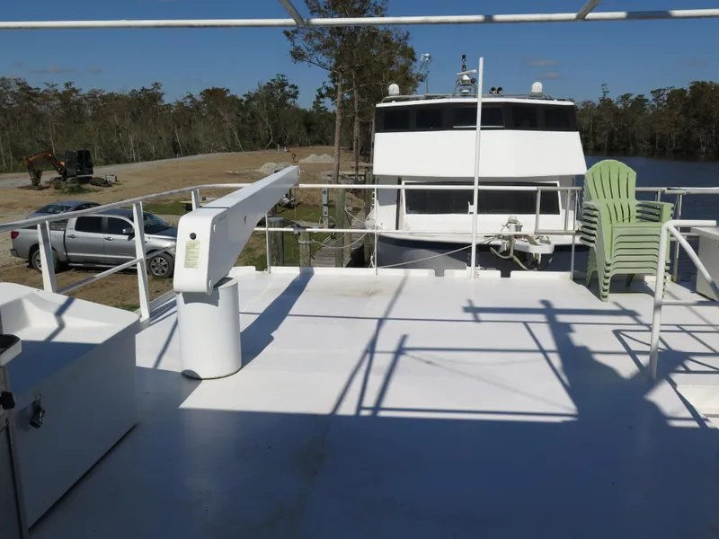 Slide: The Image of Upper deck of a 1998 Rodriquez Custom boat with outdoor seating. - 2