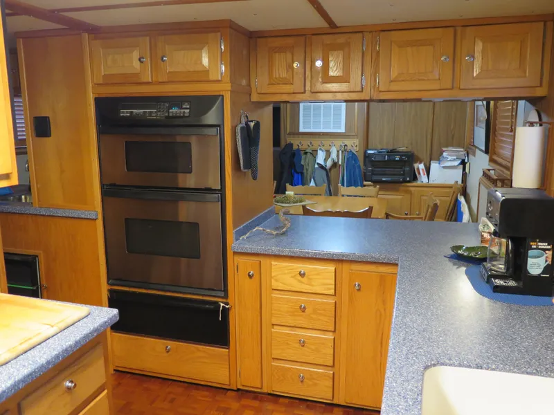 Slide: The Image of 1998 Rodriquez Custom kitchen with wooden cabinets and double oven. - 21