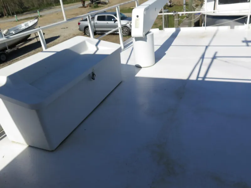 Slide: The Image of Rodriquez Custom 1998 boat deck with storage box and crane. - 3