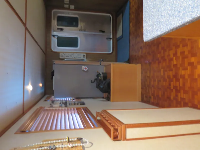 Slide: The Image of Interior of a 1998 Rodriquez Custom RV with wood paneling and parquet flooring. - 30