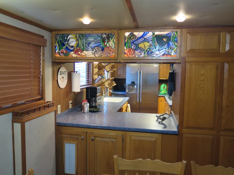 Slide: The Image of 1998 Rodriquez Custom kitchen with stained glass cabinets and modern appliances. - 32