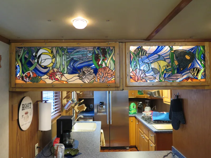 Slide: The Image of Stained glass kitchen cabinets in a 1998 Rodriquez Custom boat. - 34
