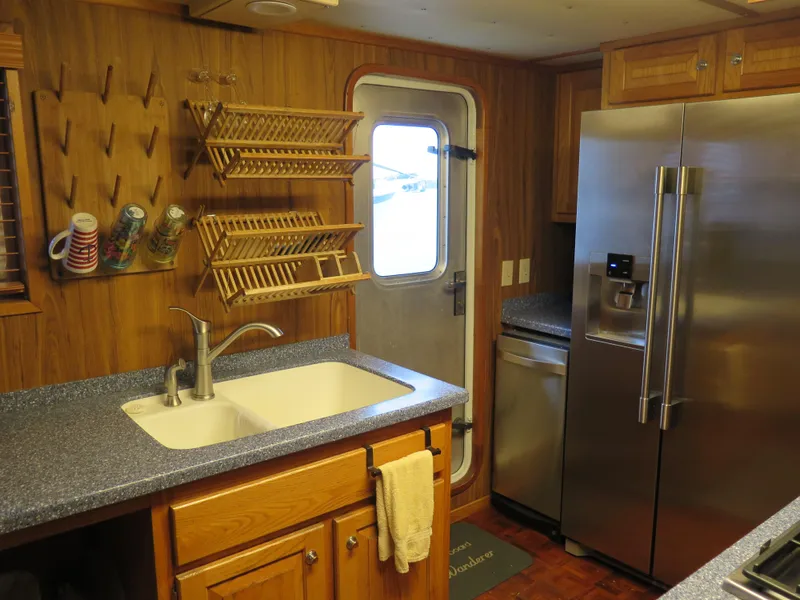 Slide: The Image of Modern kitchen in a 1998 Rodriquez Custom boat with stainless steel appliances. - 42