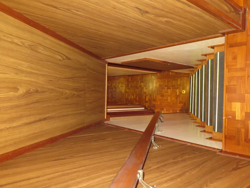 Slide: The Image of 1998 Rodriquez Custom wooden staircase with handrails and parquet flooring. - 45