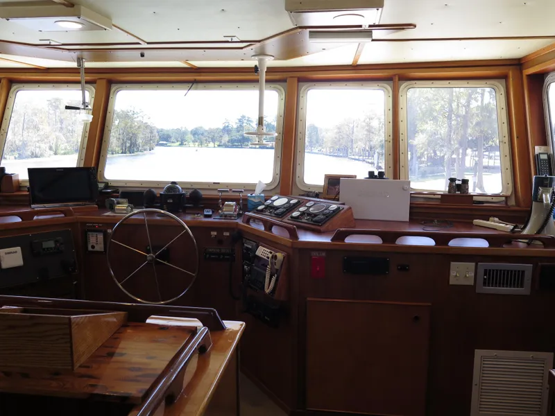 Slide: The Image of Rodriquez Custom 1998 boat cockpit with navigation equipment and panoramic windows. - 7