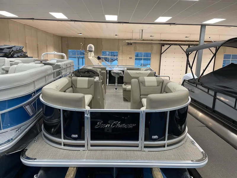 Slide: The Image of 2022 SunChaser Geneva Cruise 22 LR PSB pontoon boat in showroom. - 2