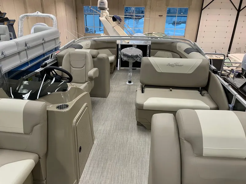 Slide: The Image of 2022 SunChaser Geneva Cruise 22 LR PSB pontoon boat interior with beige seating. - 6